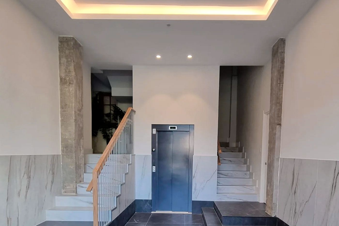 Reforma portal ascensor escaleras 